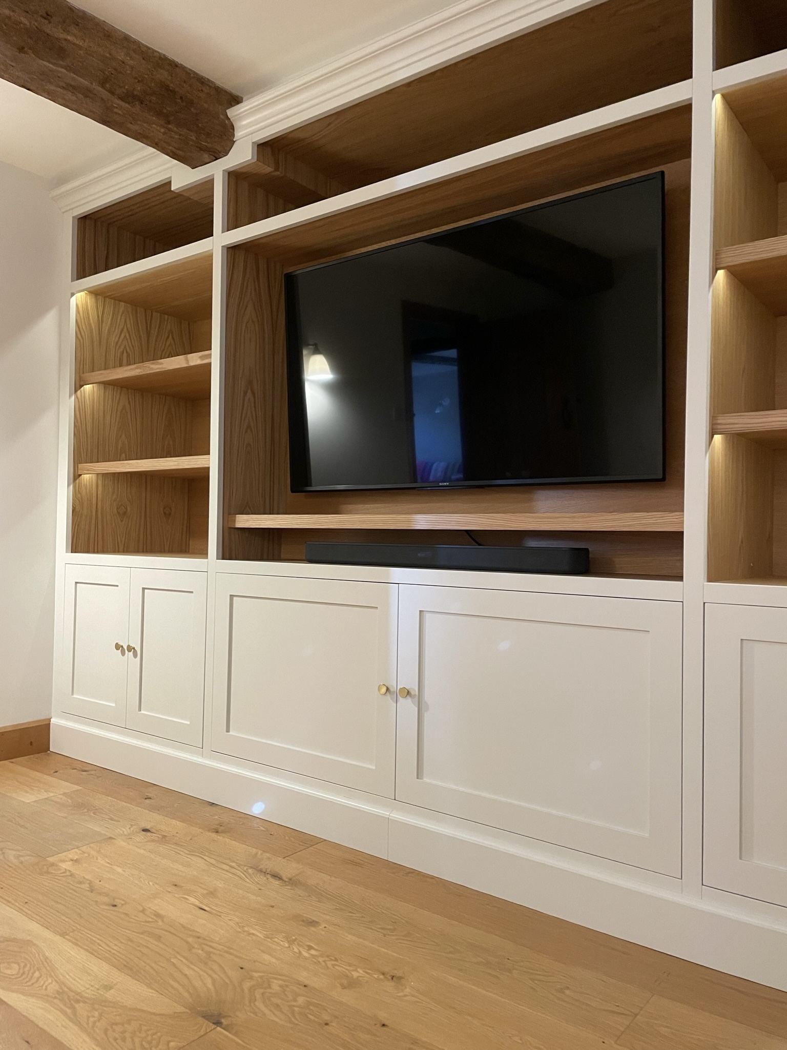Media cabinetry fitted around original beams