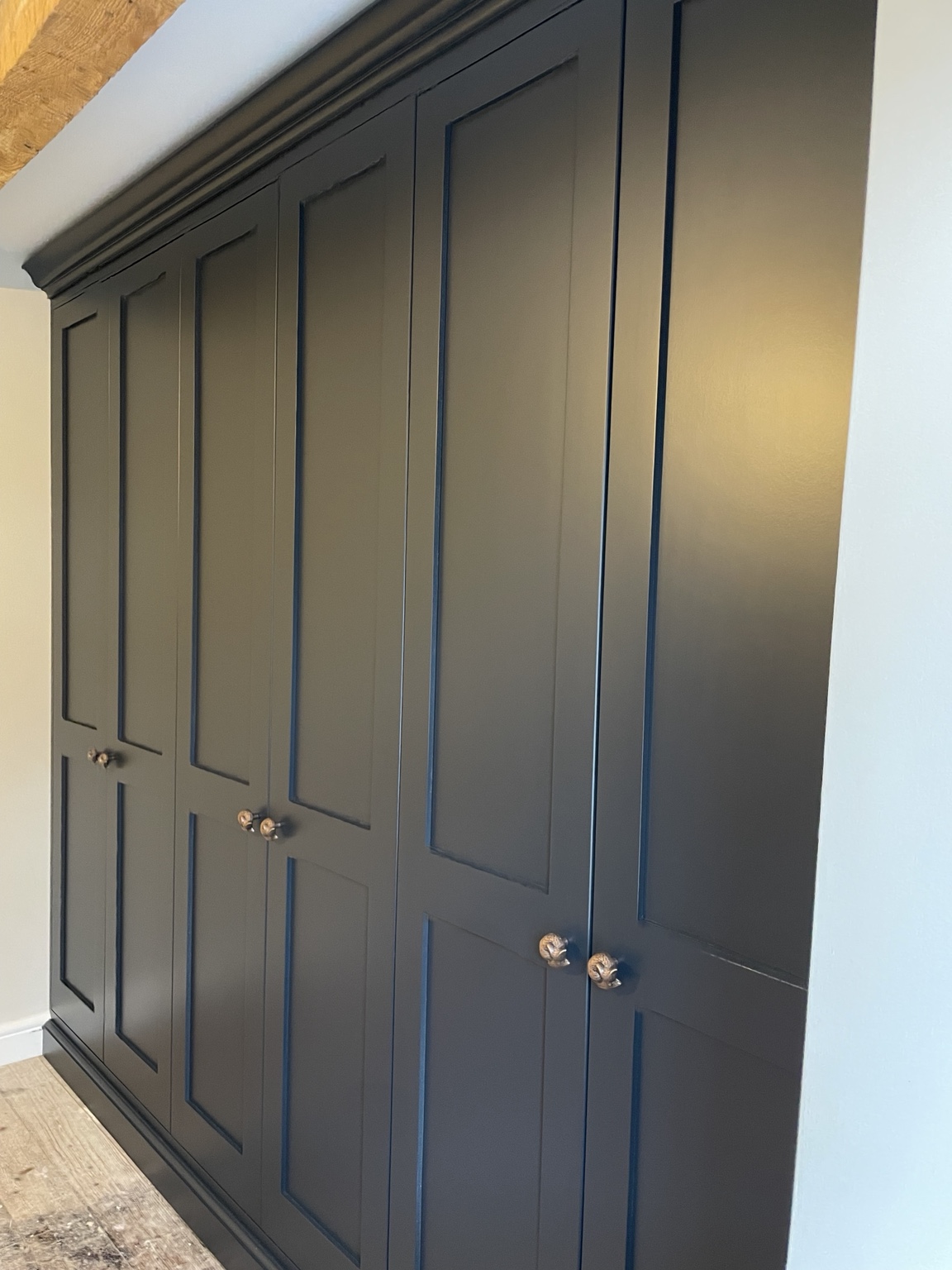 Charcoal fitted wardrobes with traditional panelled doors