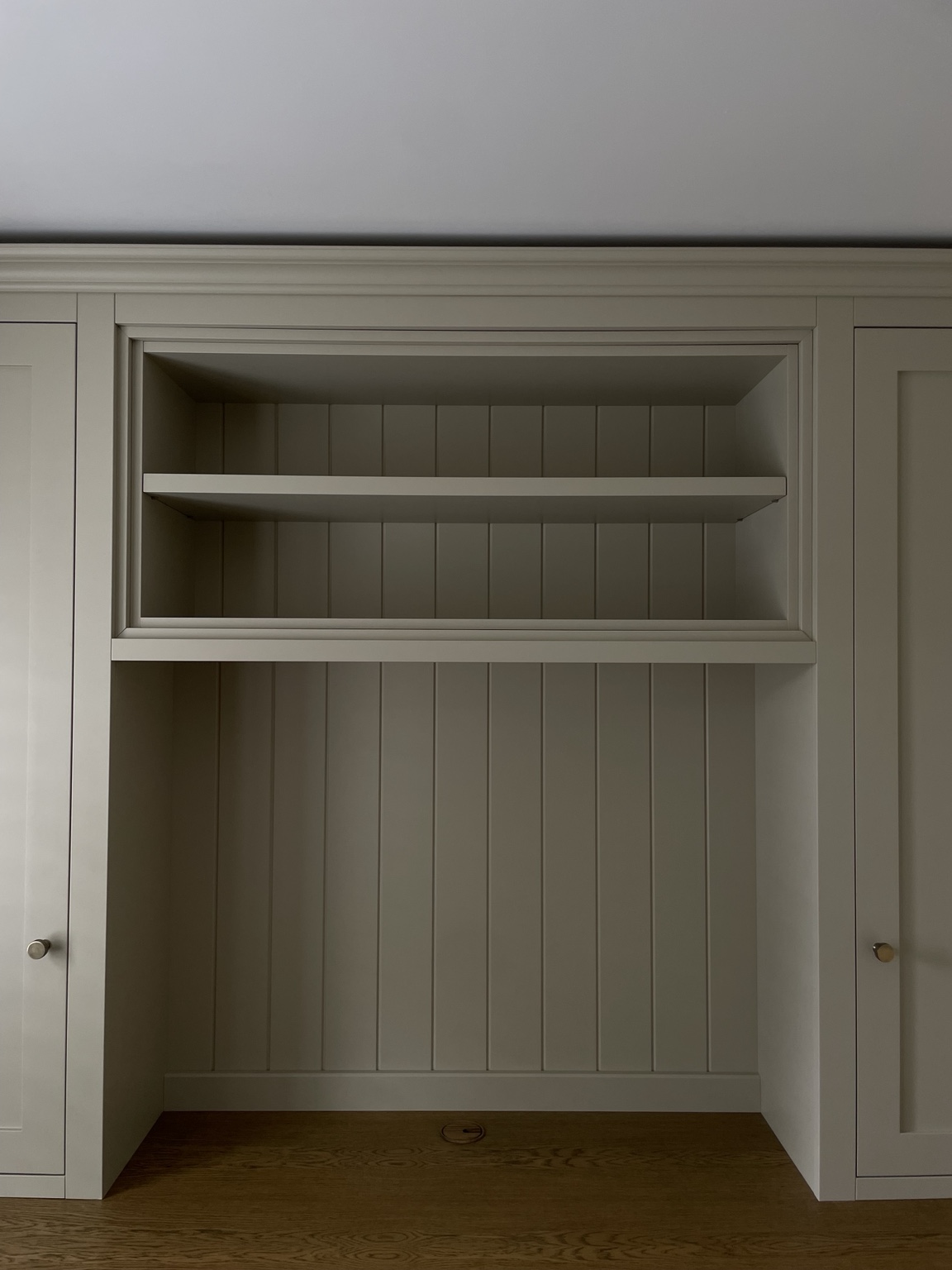 Fitted dressing table with oak worktop, painted cabinetry and open shelves