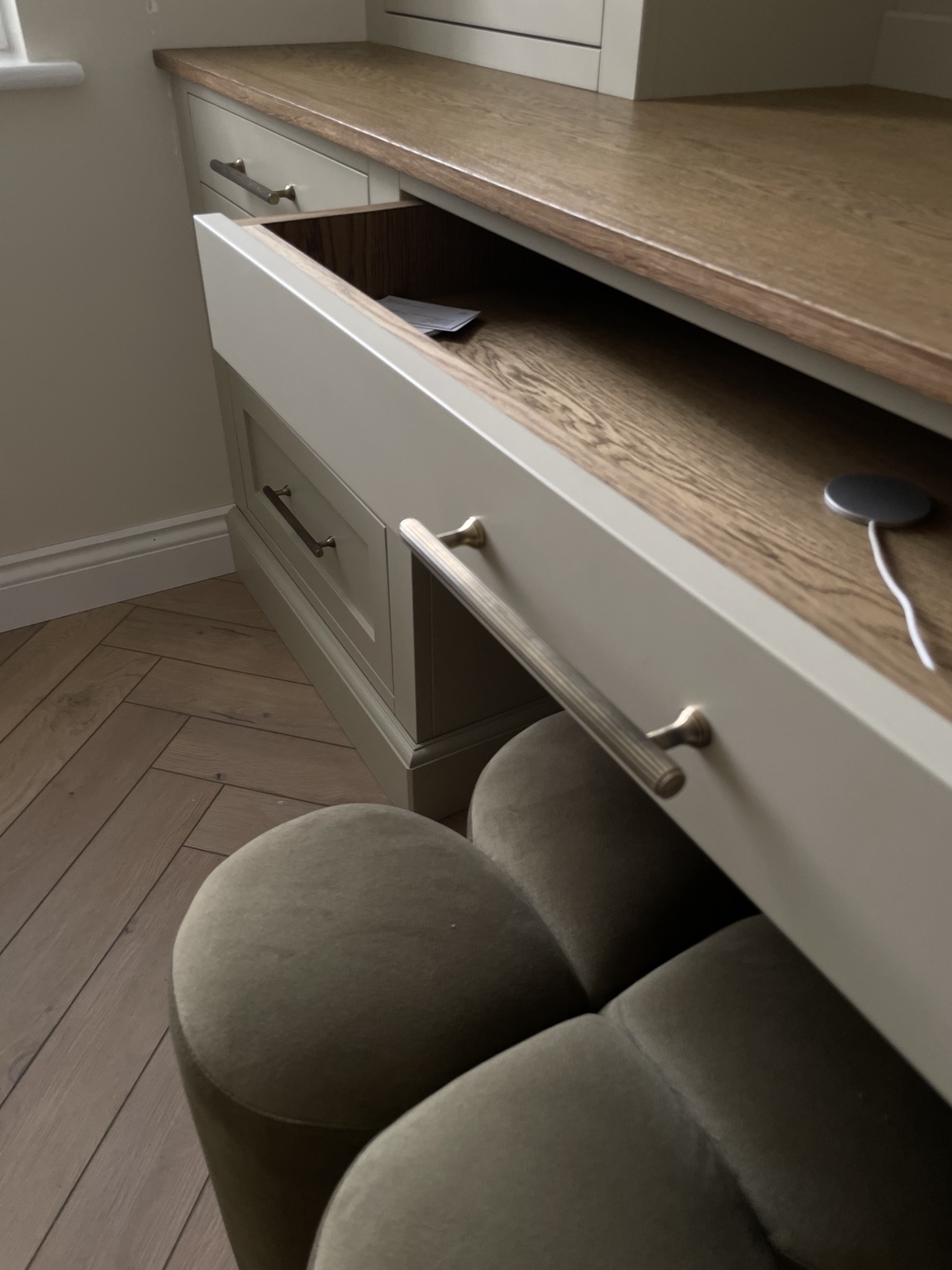 Close-up of handcrafted oak drawer interior and brass handle